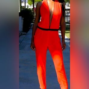 🔥NWOT Orange deep V-neck jumpsuit🔥
